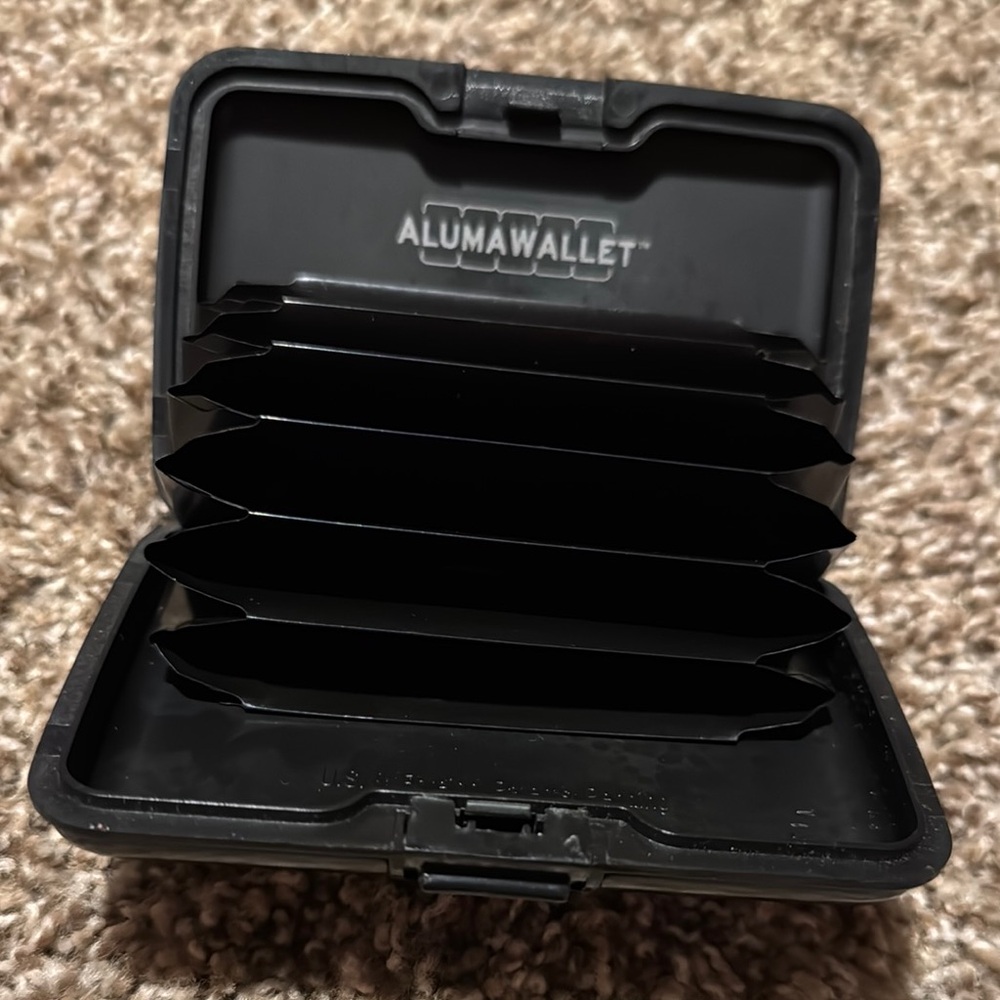 Black Alumawallet w/secure closure, multiple card/cash slots, RFID protection